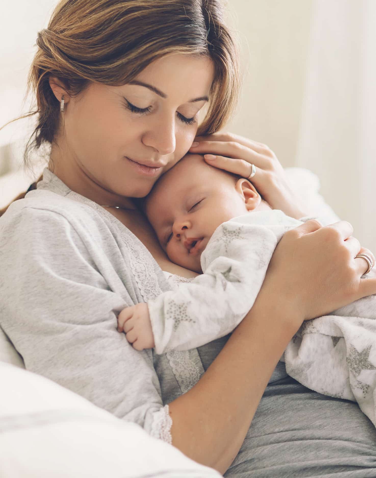 Woman Holding Newborn- Fertility and Sperm Donation Services make scenes like this possible!